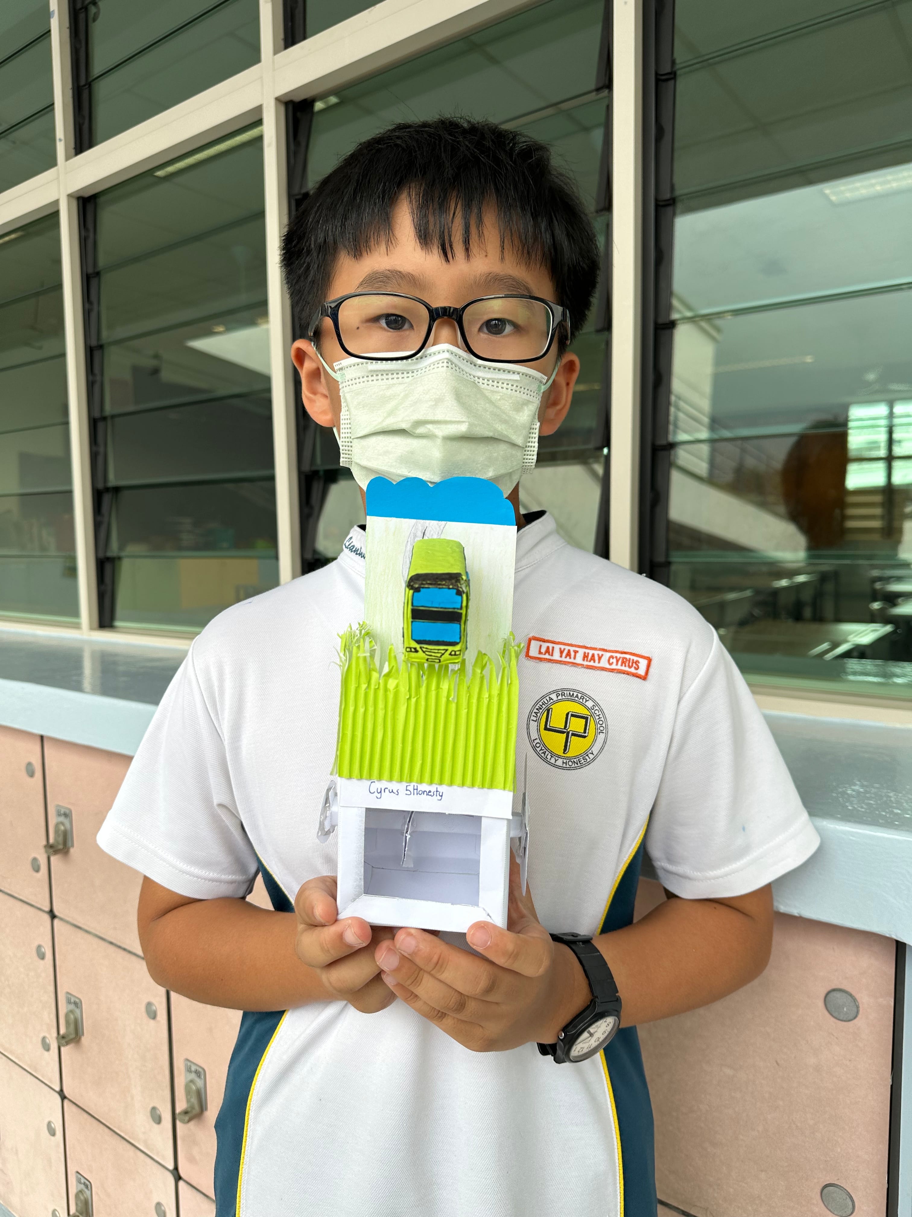 Boy with his experiment work.